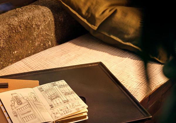 открытая тетрадь с эскизами зданий