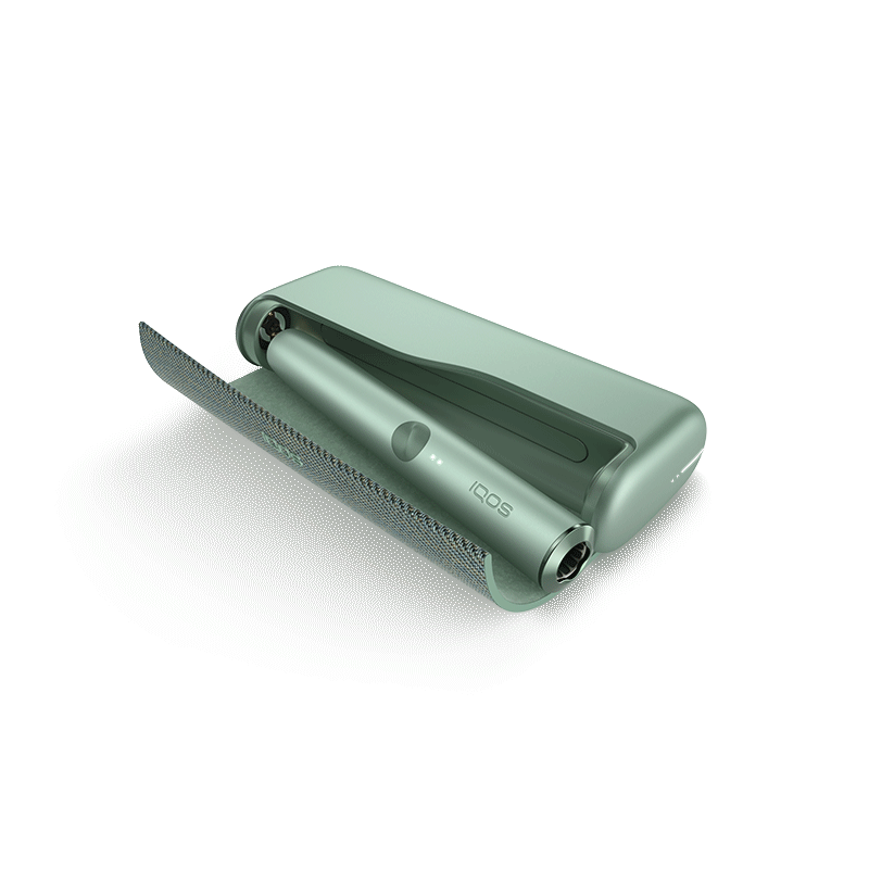 Jade Green IQOS ILUMA PRIME turētājs uzlādes stacijā.